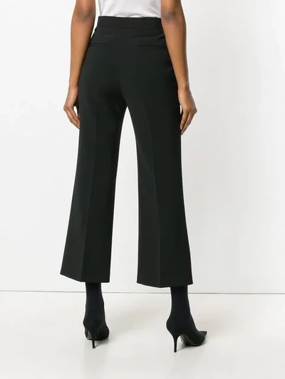 Shop Fendi Cropped Flared Trousers In Black
