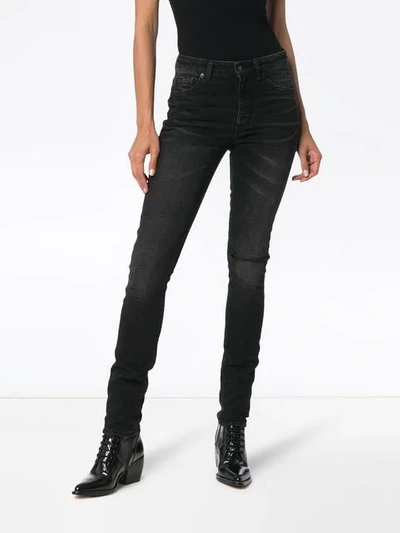 Shop Saint Laurent Ripped Skinny Jeans In Black