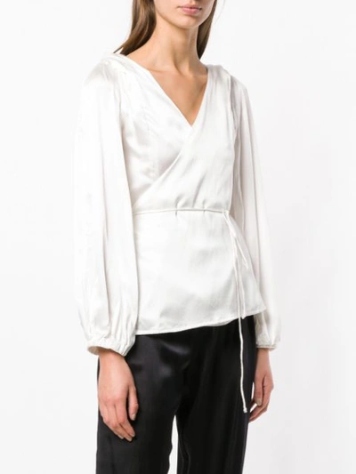 Shop Coup De Coeur Twisted Shoulder Wrap-blouse - White