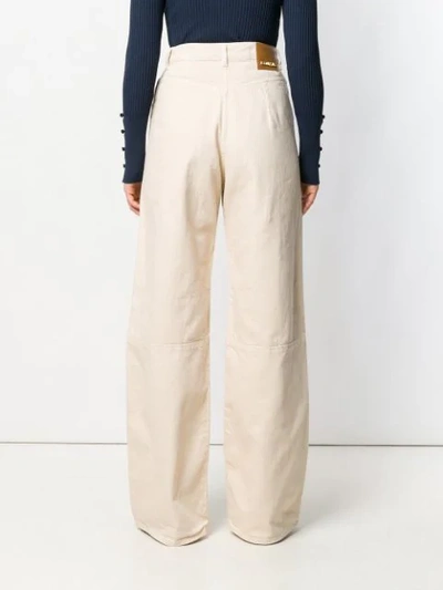Shop Jacquemus Flared Jeans In Neutrals
