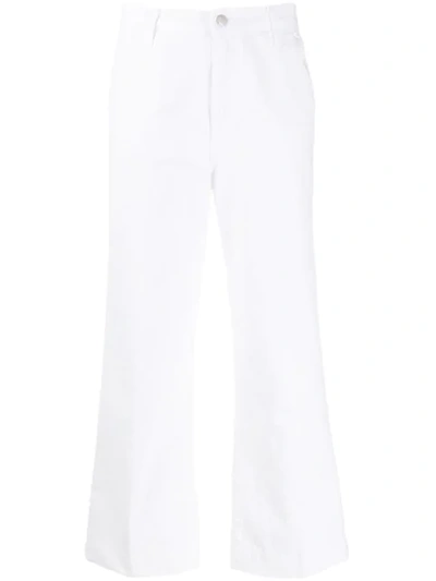 Shop J Brand Flared Jeans In White