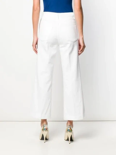 Shop J Brand Flared Jeans In White