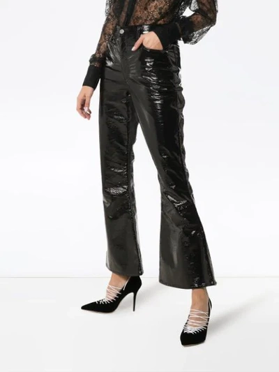 Shop Beaufille Veritas Kick Flare Vinyl Trousers In Black