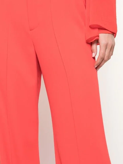 Shop Alice And Olivia Flared Trousers In Red