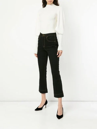 Shop Khaite Fiona Cropped Flare Jeans In Blue
