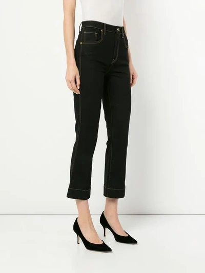 Shop Khaite Fiona Cropped Flare Jeans In Blue