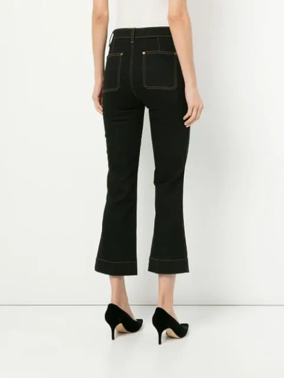 Shop Khaite Fiona Cropped Flare Jeans In Blue