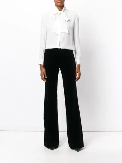 Shop Gucci Flared Trousers In Black