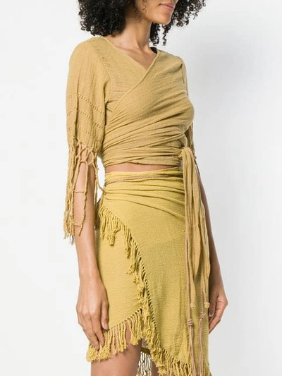 Shop Caravana Wrap Top With Fringe Sleeves In Yellow
