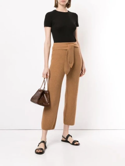 Shop Nanushka Belted Ribbed Knit Trousers - Brown
