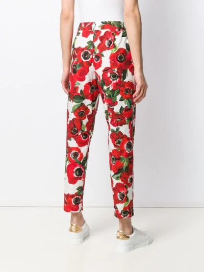 Shop Dolce & Gabbana Floral Print Trousers In Red