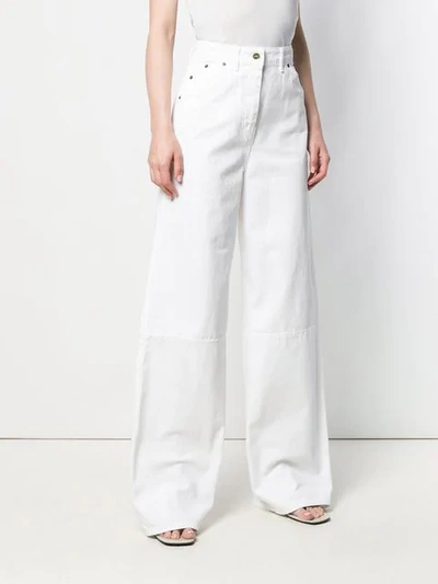 Shop Jacquemus Wide Leg Trousers In White