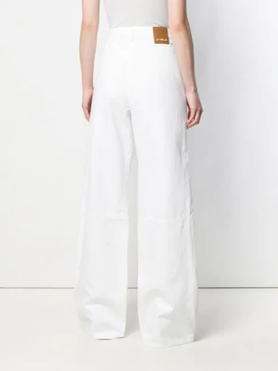 Shop Jacquemus Wide Leg Trousers In White