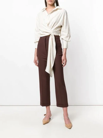 Shop Jacquemus Creased Tapered Trousers - Brown