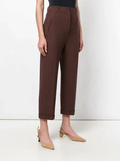 Shop Jacquemus Creased Tapered Trousers - Brown
