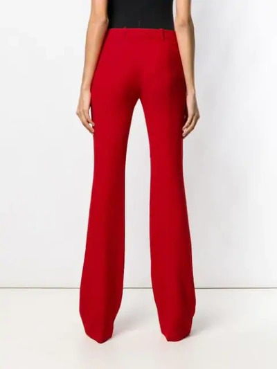 Shop Alexander Mcqueen Bootcut Trousers In Red