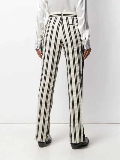 Shop Ann Demeulemeester Striped Trousers - White