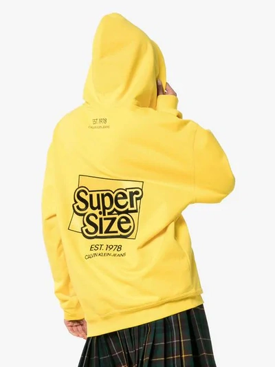 Shop Calvin Klein Jeans Est.1978 Super Size Graphic Hoodie In Yellow