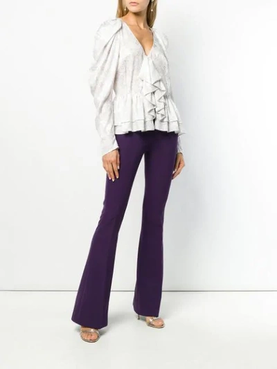 Shop Blanca Flared Trousers In Purple
