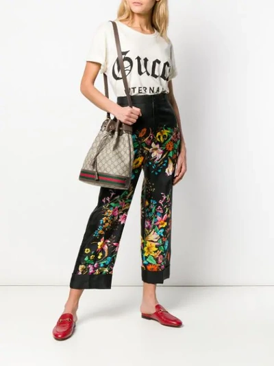 Shop Gucci Floral Print Cropped Trousers In Black
