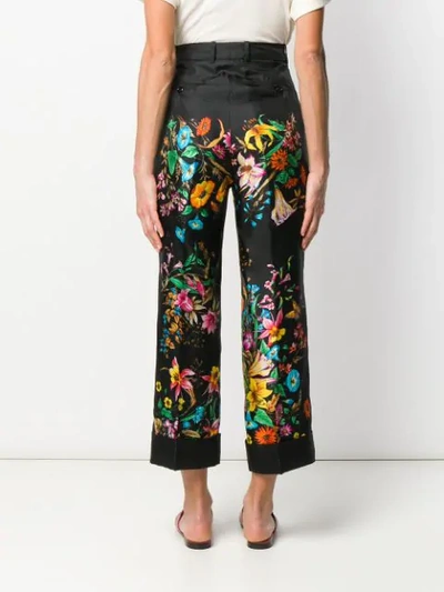 Shop Gucci Floral Print Cropped Trousers In Black