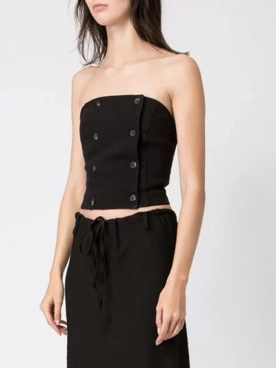Shop Masnada Strapless Buttoned Top In Black