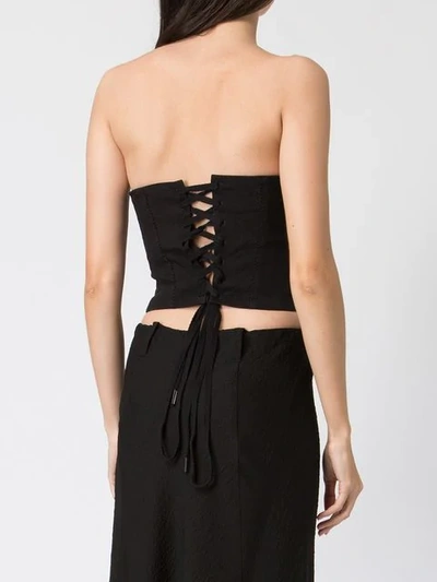 Shop Masnada Strapless Buttoned Top In Black