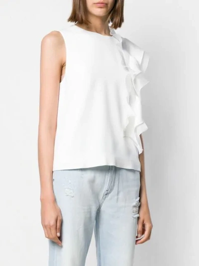 Shop Genny Ruffled Sleeveless Blouse In White