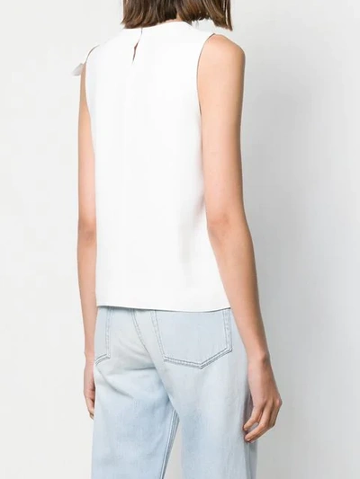 Shop Genny Ruffled Sleeveless Blouse In White