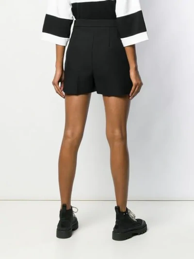 Shop Msgm Creased Shorts In Black