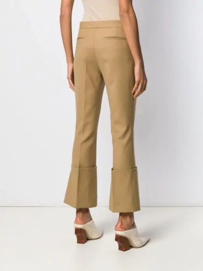 Shop Rokh Cropped Flared Trousers In Neutrals