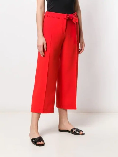 Shop Pinko Tie Waist Cropped Trousers In Red