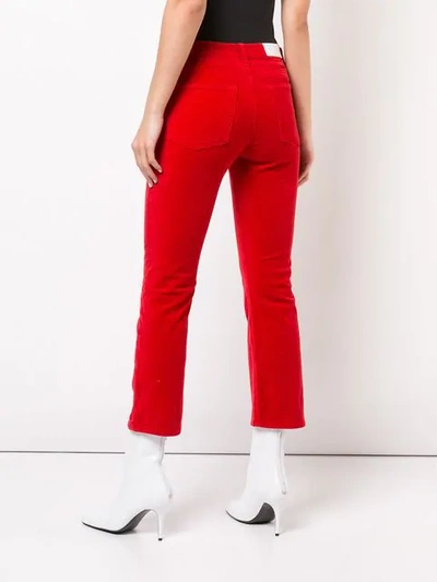 Shop Re/done Velvet Kick Flare Cropped Trousers In Red