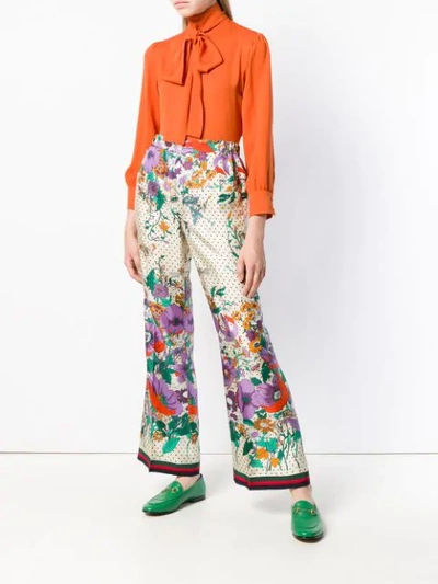 Shop Gucci Floral Flared Trousers In White