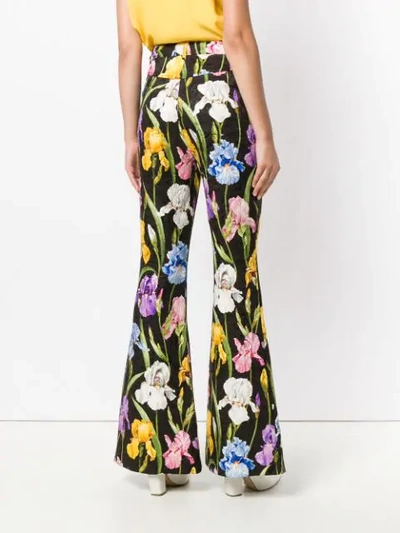 Shop Dolce & Gabbana Iris Print Flared Trousers In Black