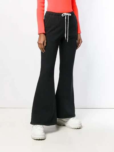 Shop Facetasm Flared Track Pants In Black