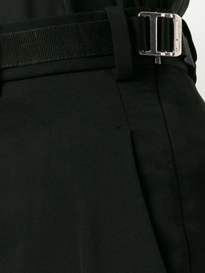 Shop Neil Barrett Twisted Seam Cropped Trousers In Black