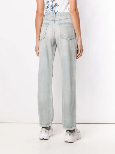 Shop John Elliott Ripped Bootcut Jeans In Blue