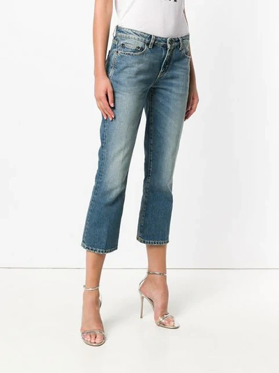 Shop Saint Laurent Cropped Bootcut Jeans In Blue