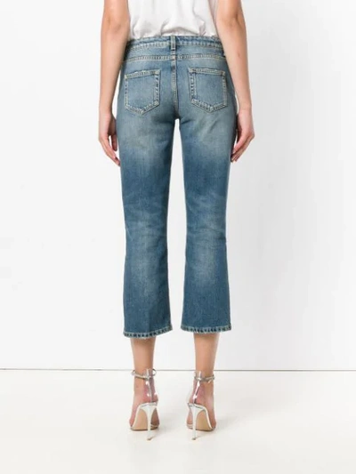 Shop Saint Laurent Cropped Bootcut Jeans In Blue