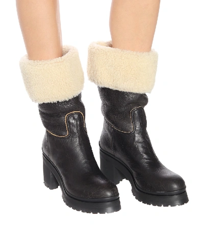 Shop Miu Miu Shearling-trimmed Leather Boots In Black