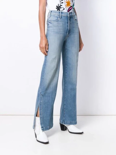 Shop Mother Slit Bootcut Jeans In Blue