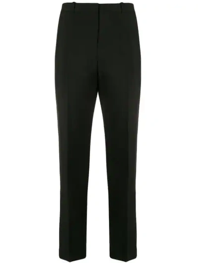 Shop Givenchy Tapered Trousers In Black