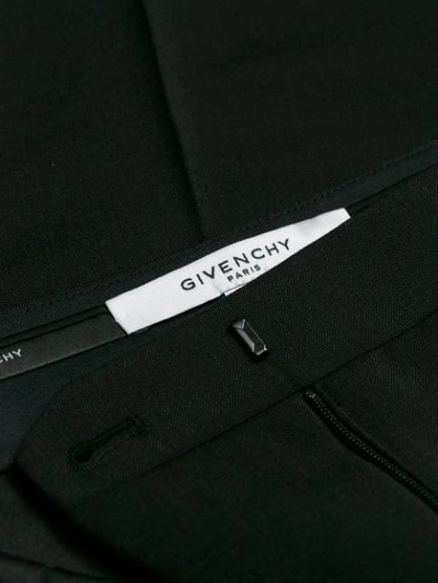 Shop Givenchy Tapered Trousers In Black