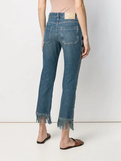 Shop Chloé Fringe Trimmed Jeans In Blue