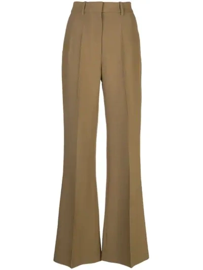 Shop Partow High-rise Flared Trousers In Green