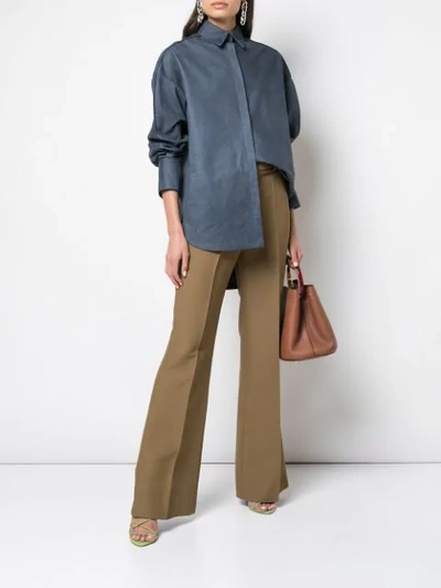 Shop Partow High-rise Flared Trousers In Green