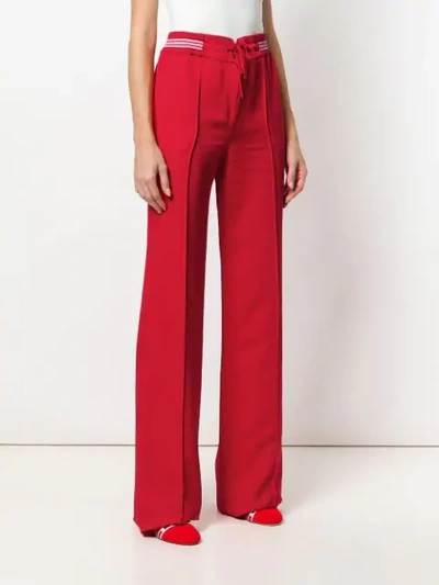 Shop Valentino Flared Fitted Trousers In Red