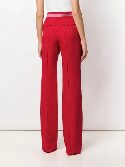 Shop Valentino Flared Fitted Trousers In Red