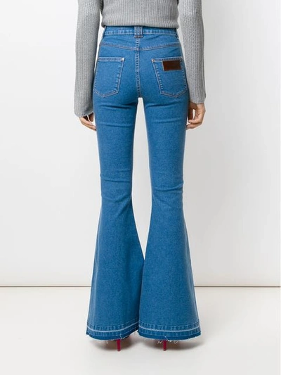 Shop Amapô Denver Flared Jeans In Blue